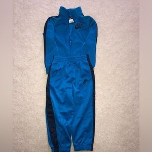 Nike 3T zip-up and joggers. Cyan blue with navy stripe.